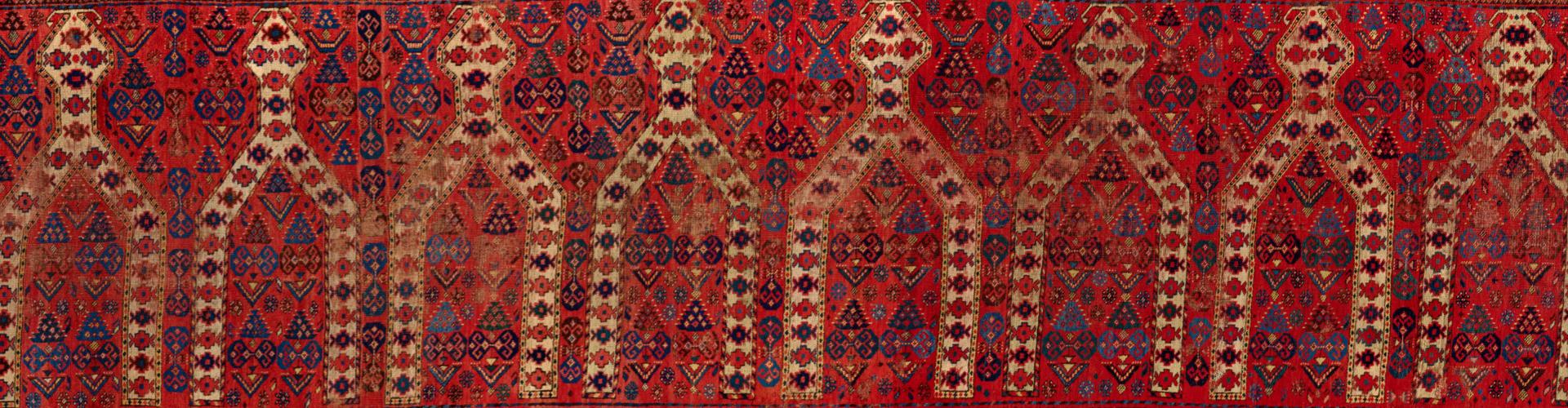 Detail of prayer carpet with arch motifs