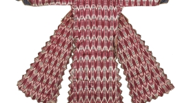 A red-and-white ikat robe spread flat