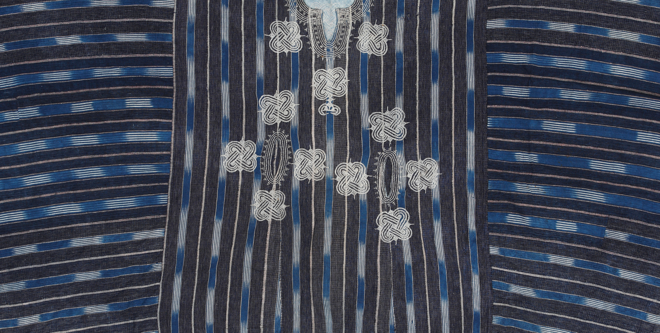 Detail of navy ikat tunic with stripes