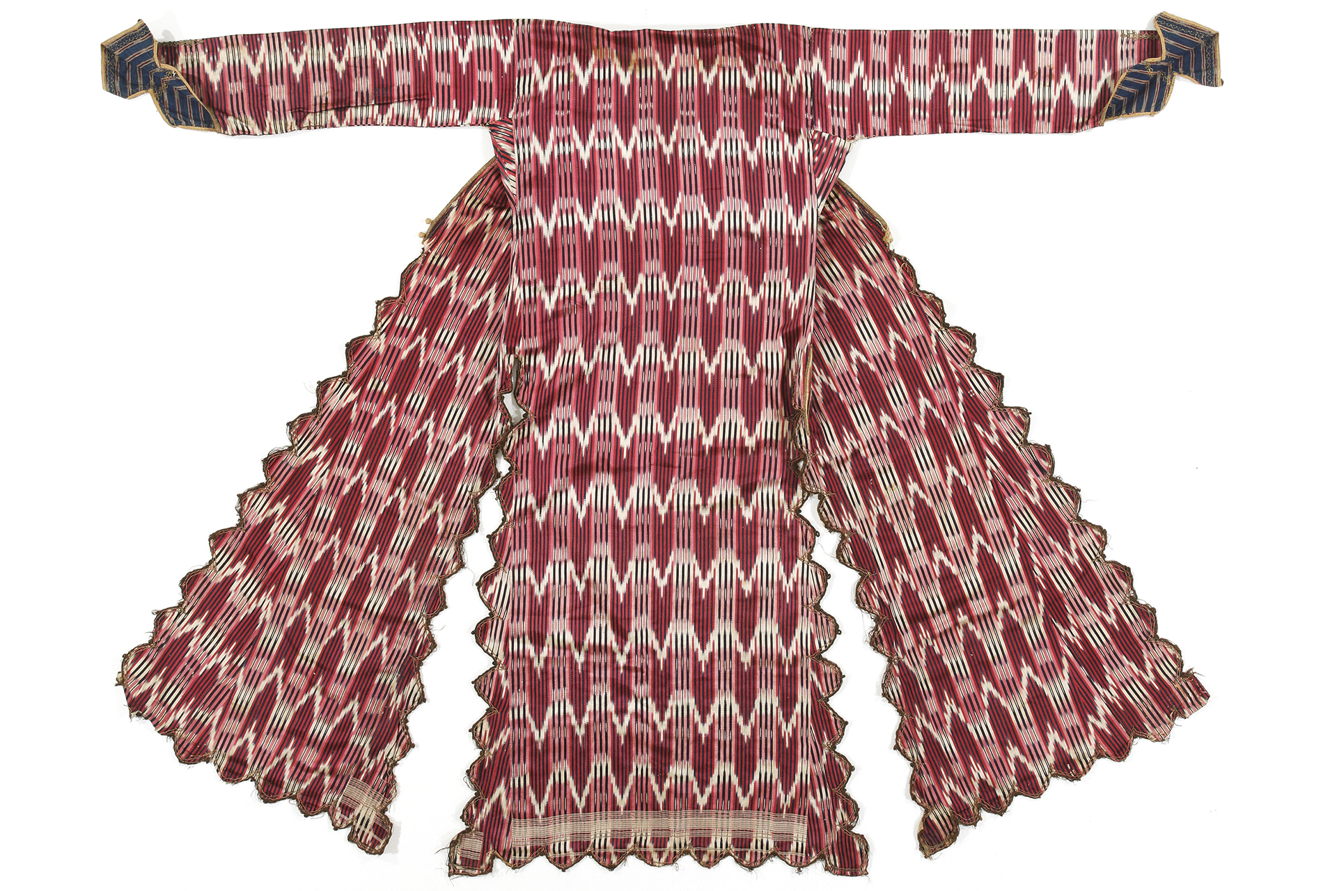 A red-and-white ikat robe spread flat