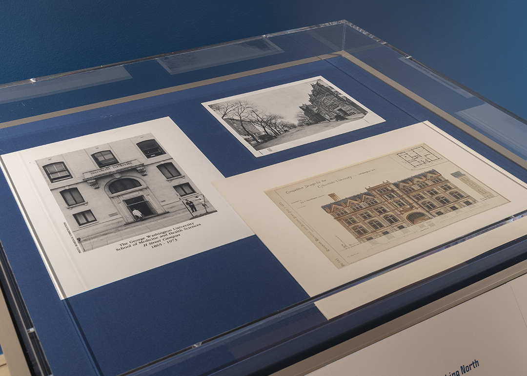 Historical photographs in a museum case