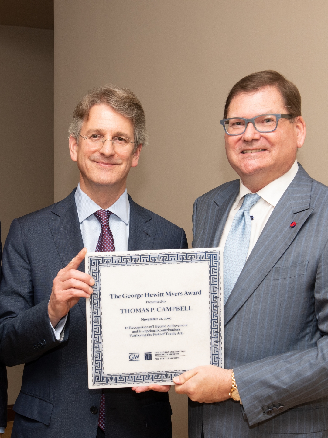 Dr. Campbell and Bruce Baganz hold up the Myers Award plaque