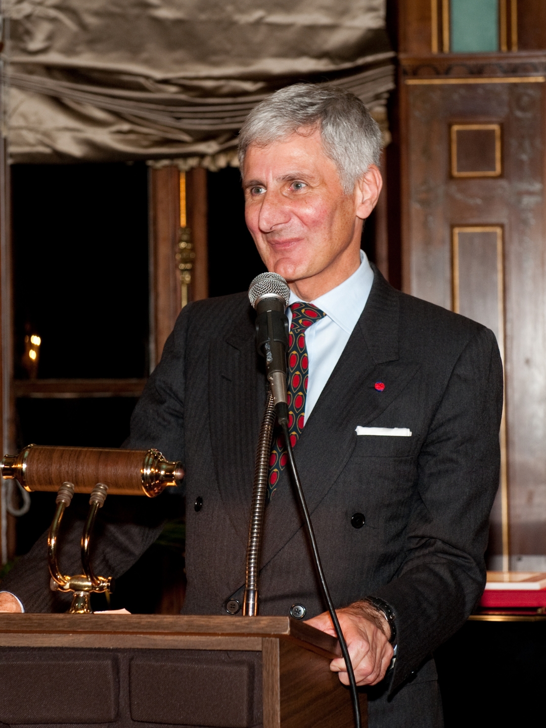 Michael Franses presents from a podium