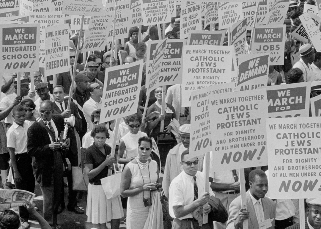 Historical black-and-white photo of a protest march