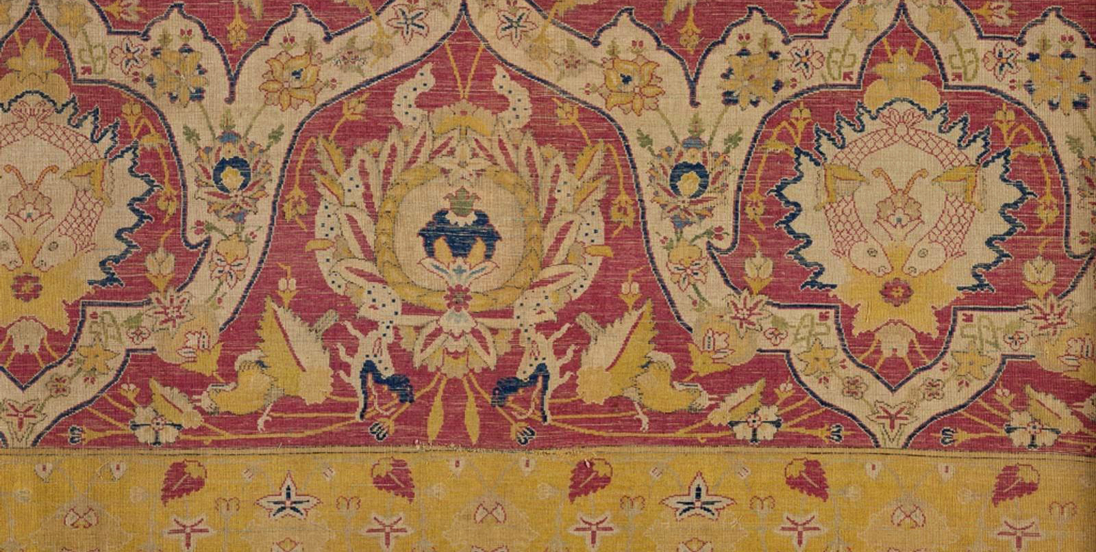 red and gold colored textile