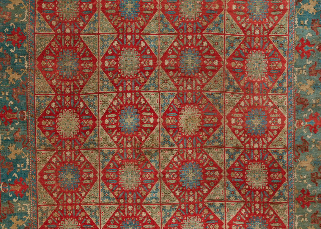 red and green textile with medallion design