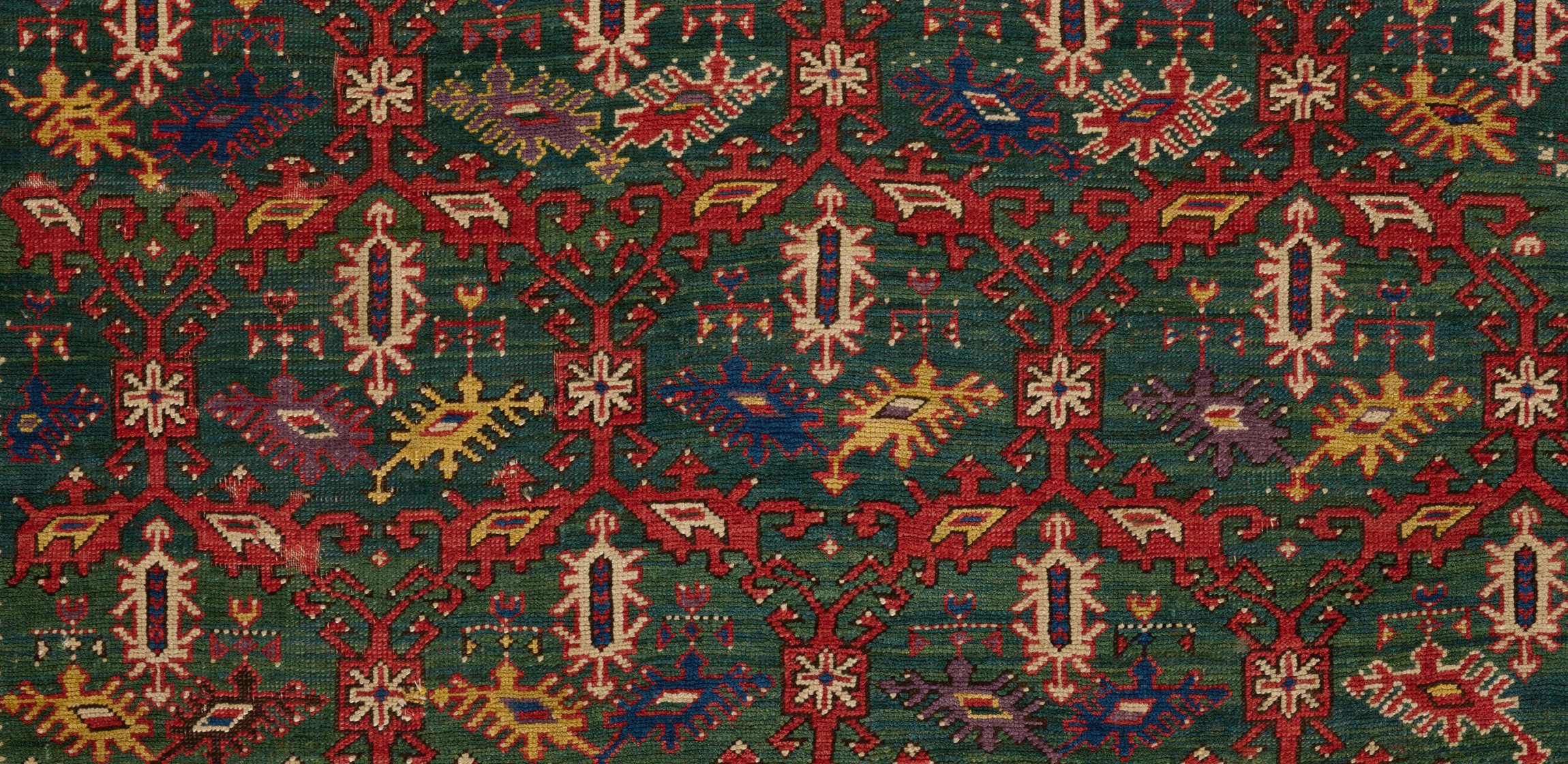 red and green rug with gold border 