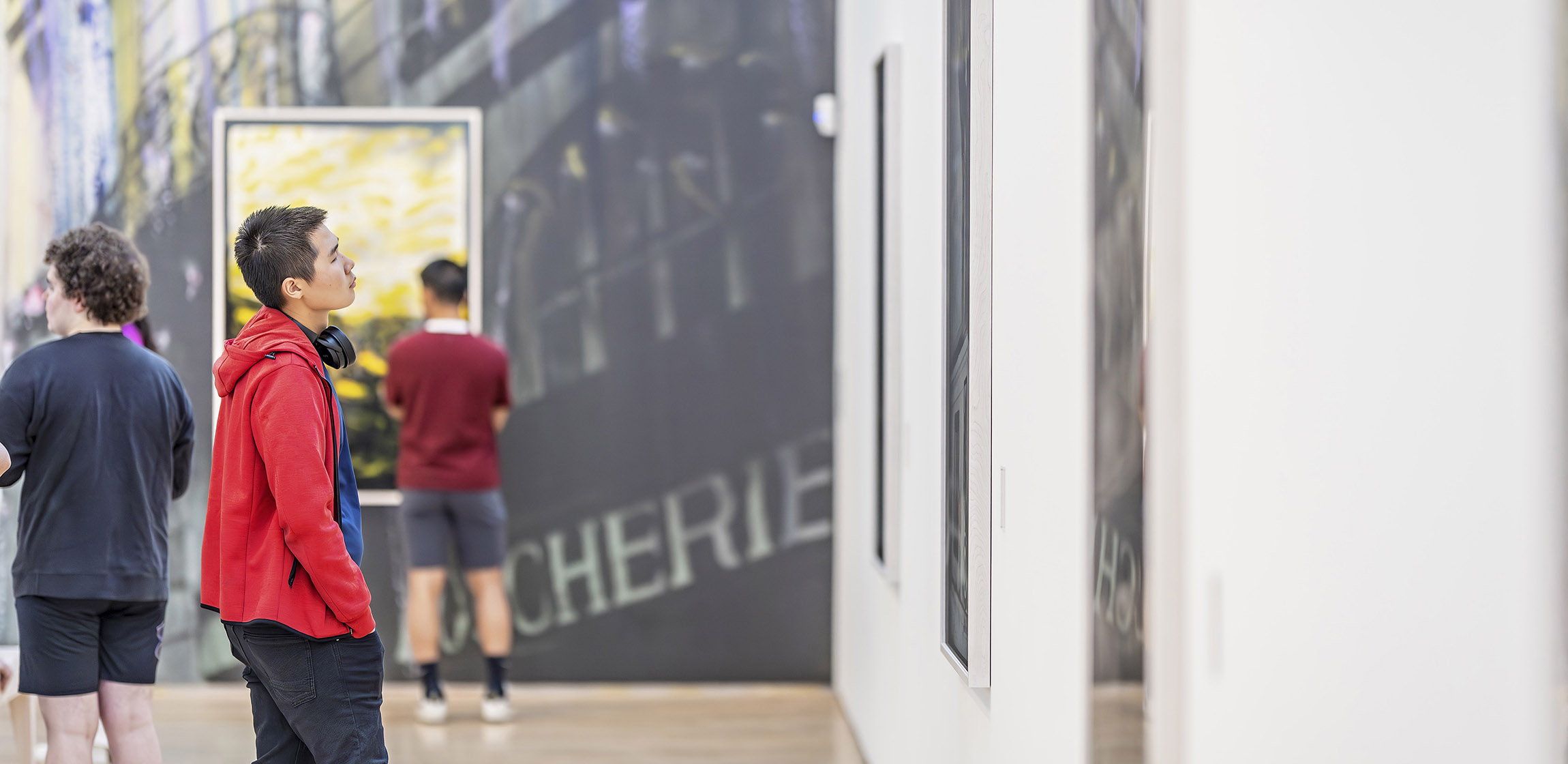 man looking at art 