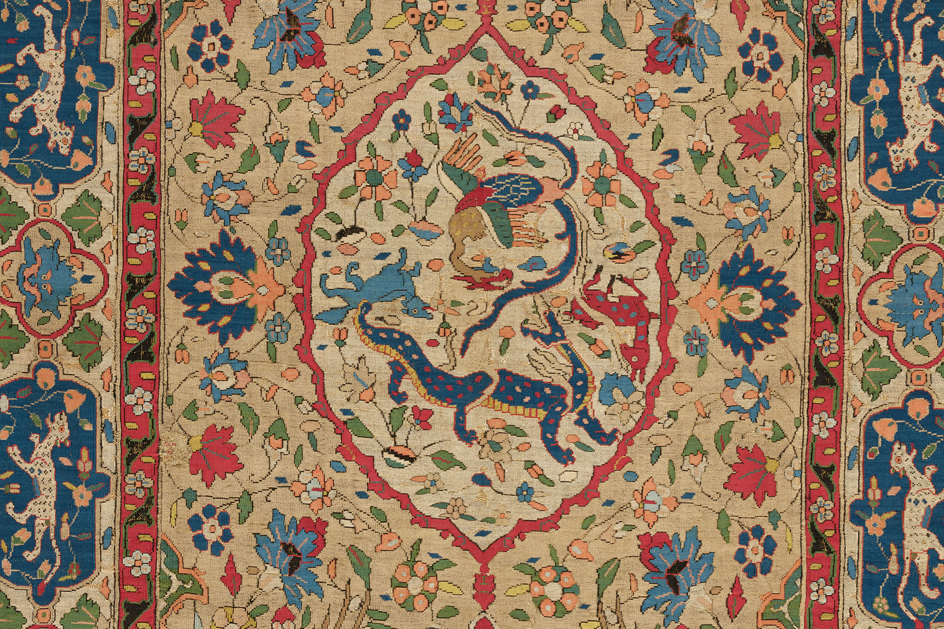 ornate carpet detail with central medallion enclosing a blue dragon