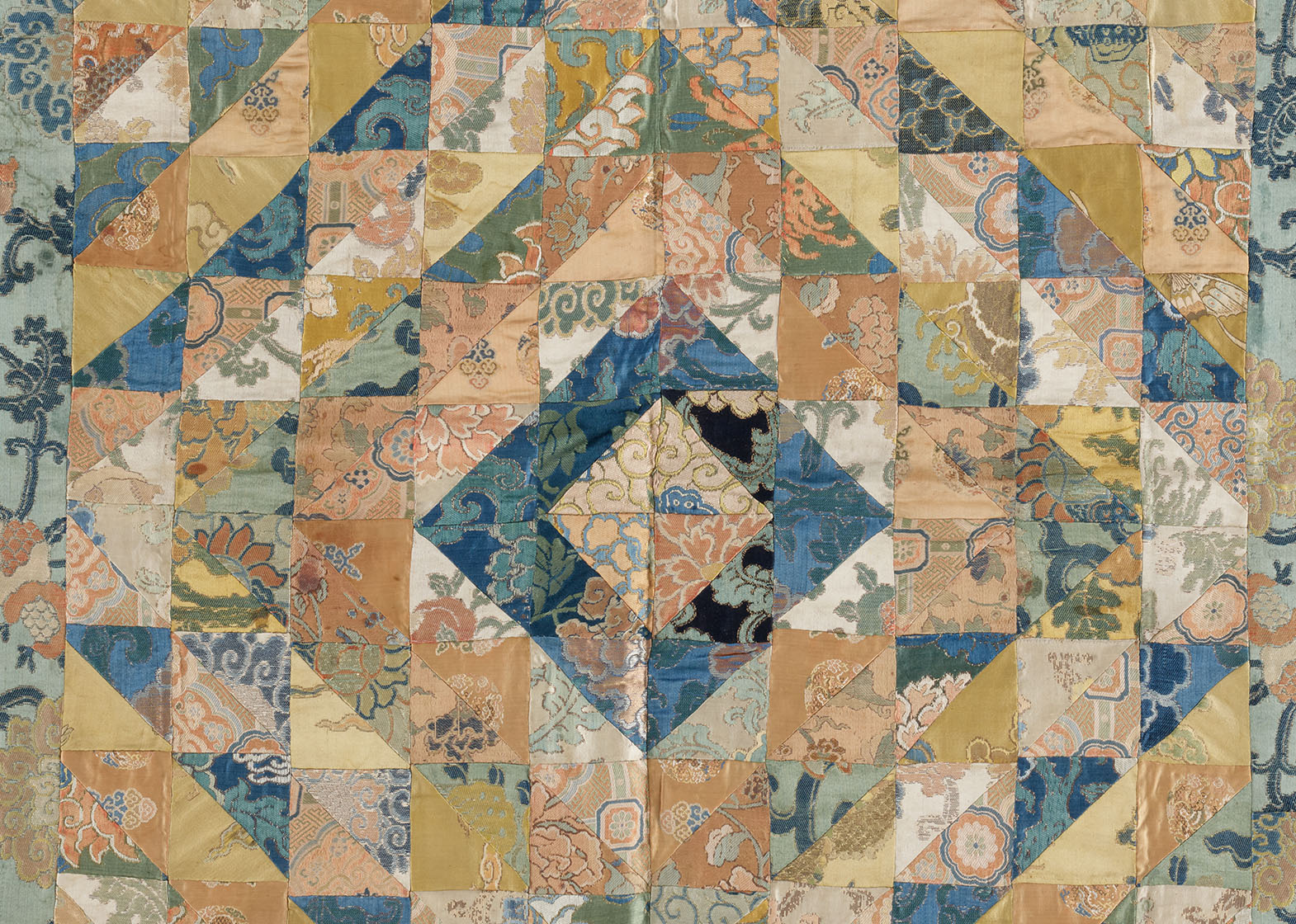 patchwork textile expanding outward in a diamond shape