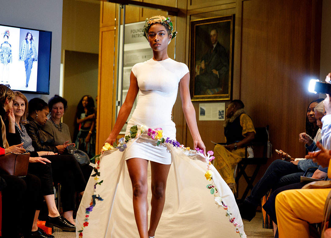 woman strutting down a runway
