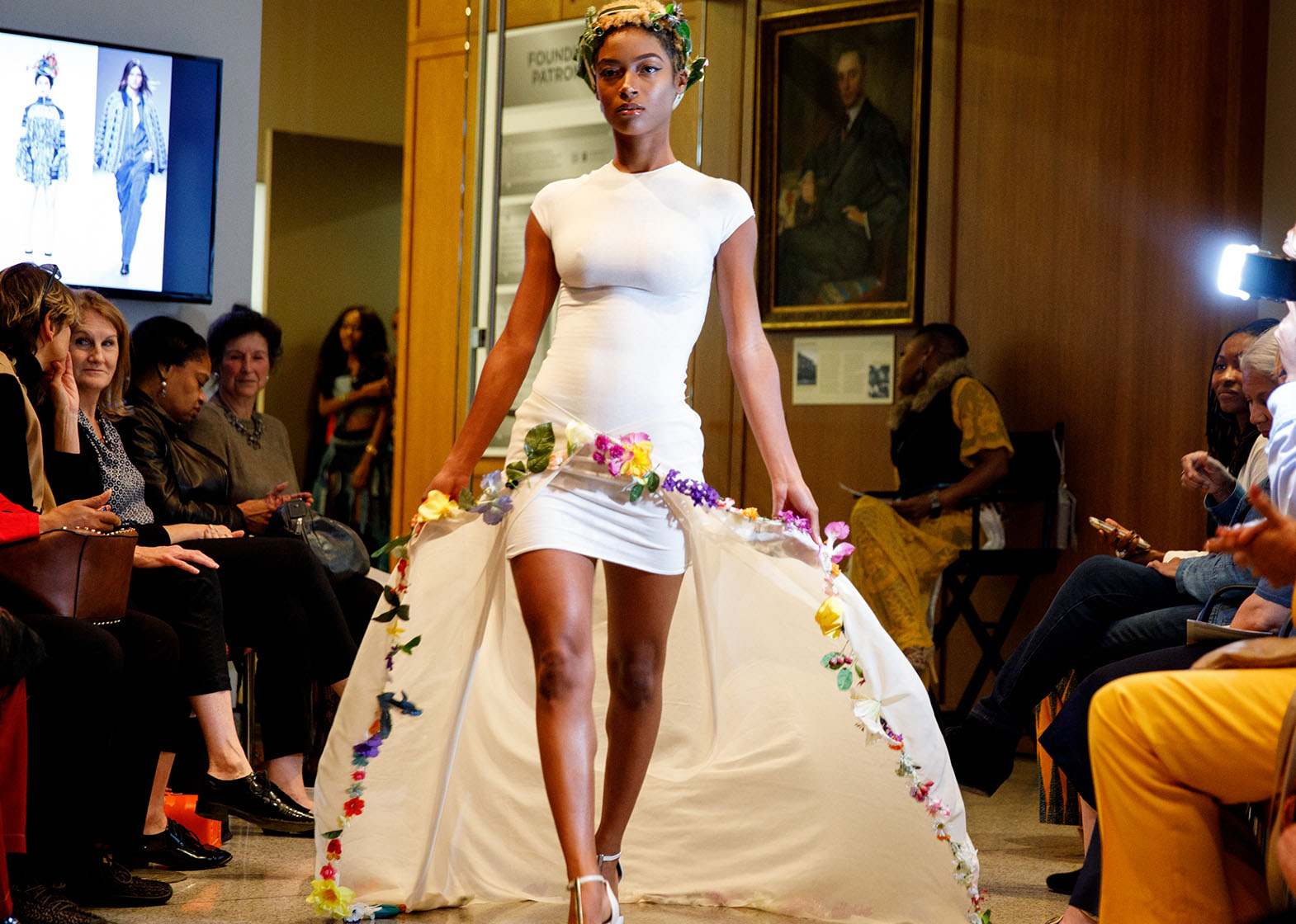 woman strutting down a runway