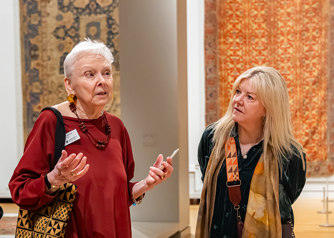 woman listening to a docent 