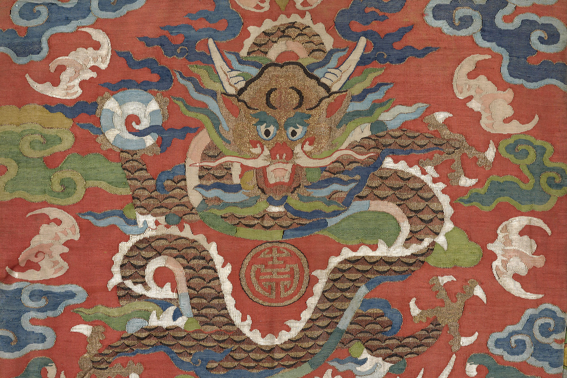 detail of a textile with a chinese dragon motif 