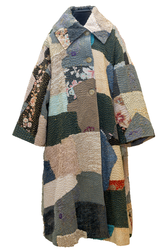 close up of multi-colored fabrics stitched together