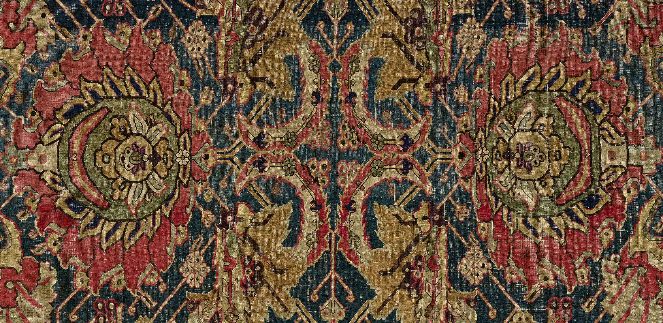 carpet with floral motifs and a center cross design