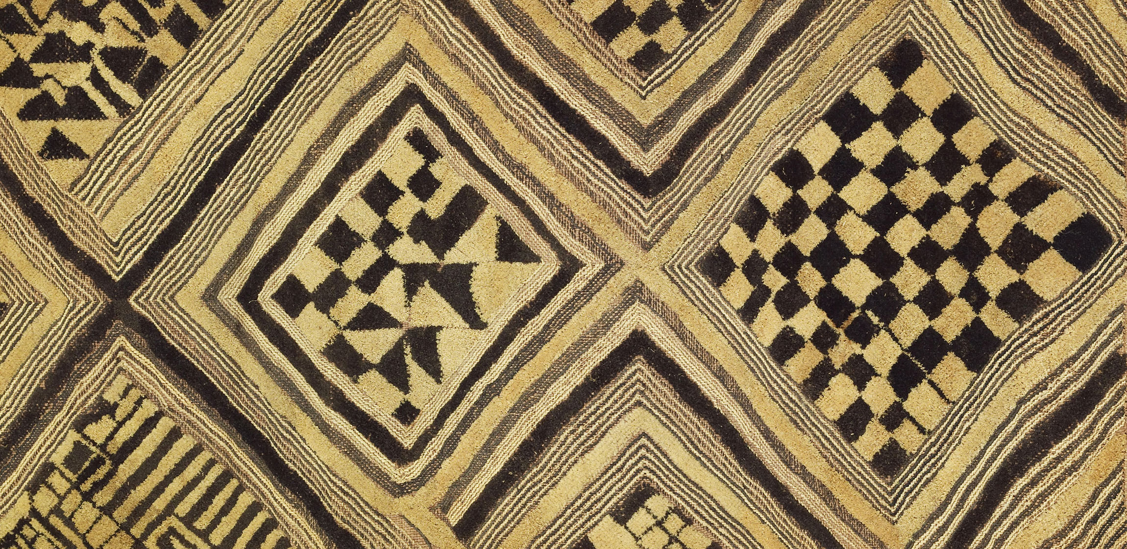 raffia grass textile with black geometric designs