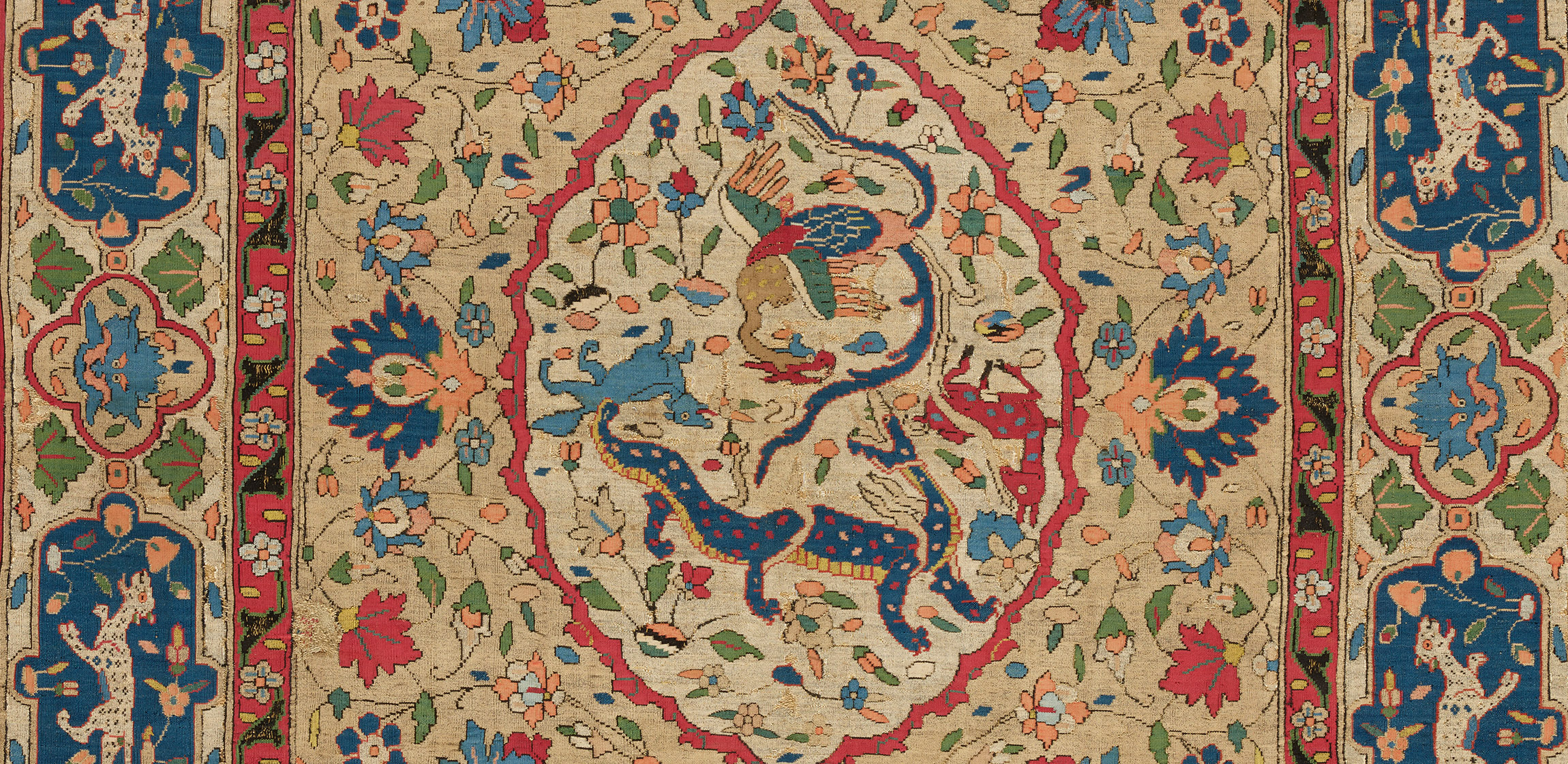 elaborate textile with central medallion with two circling blue dragons