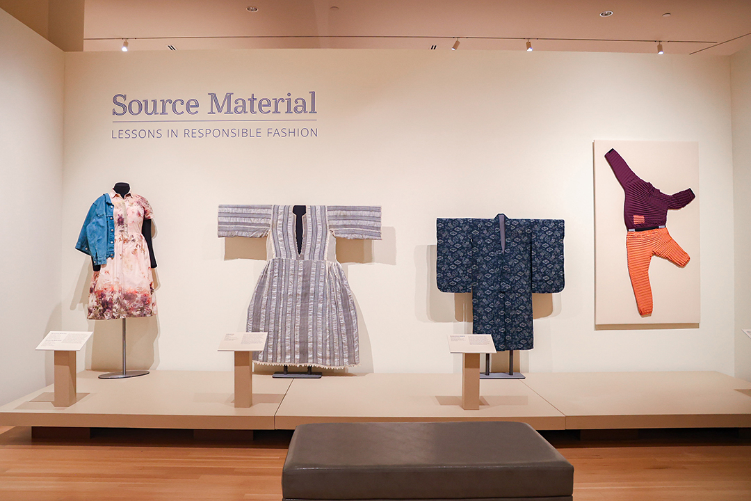 opening gallery wall with textiles on t-stands