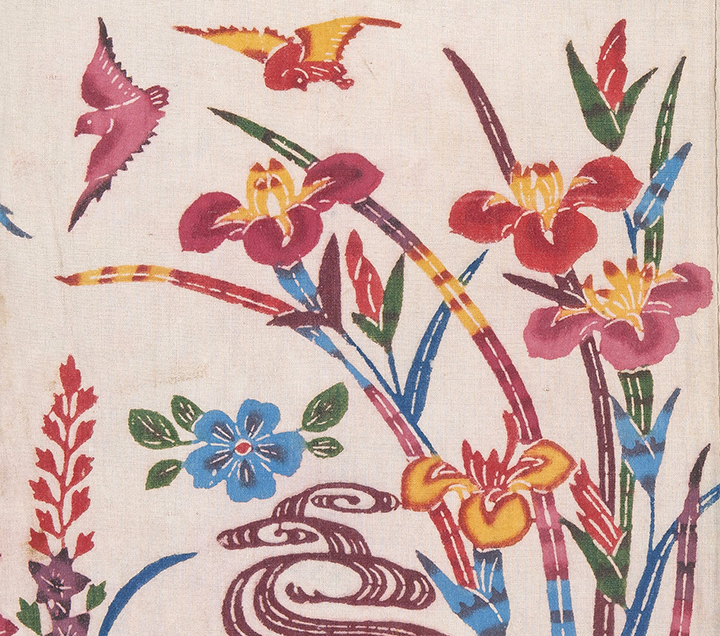 Detail of child’s costume with flowing water, gabions, iris, and birds on a white ground