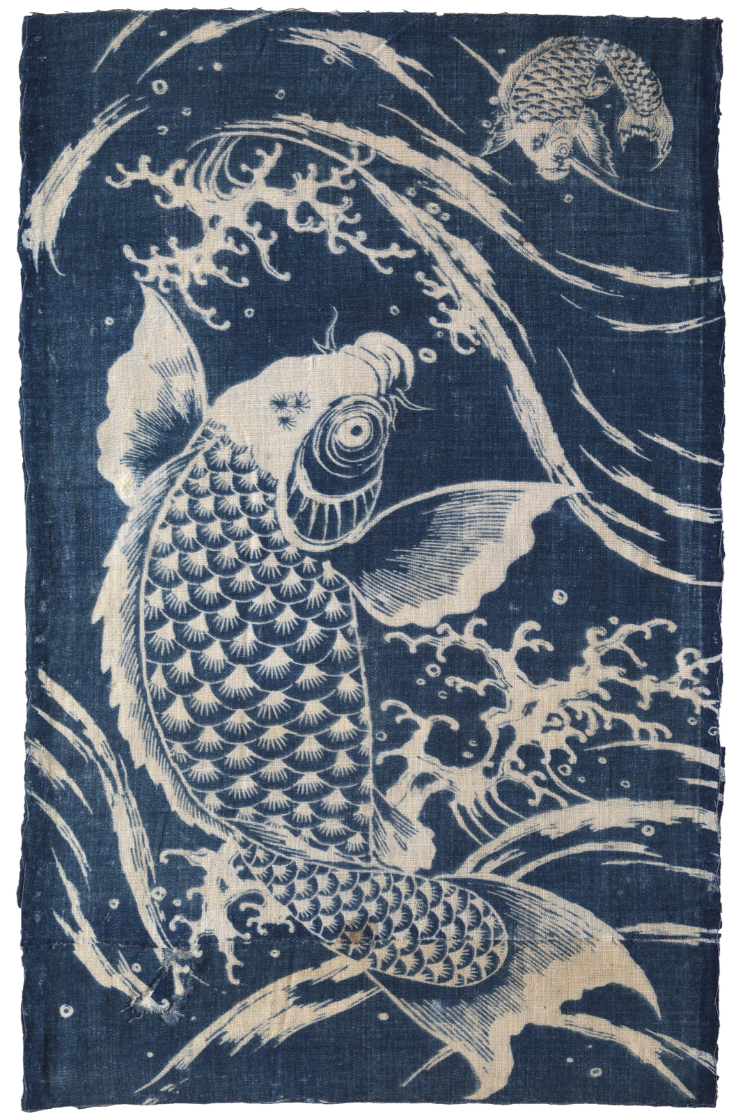 Indigo textile patterned with two carp and waves in white