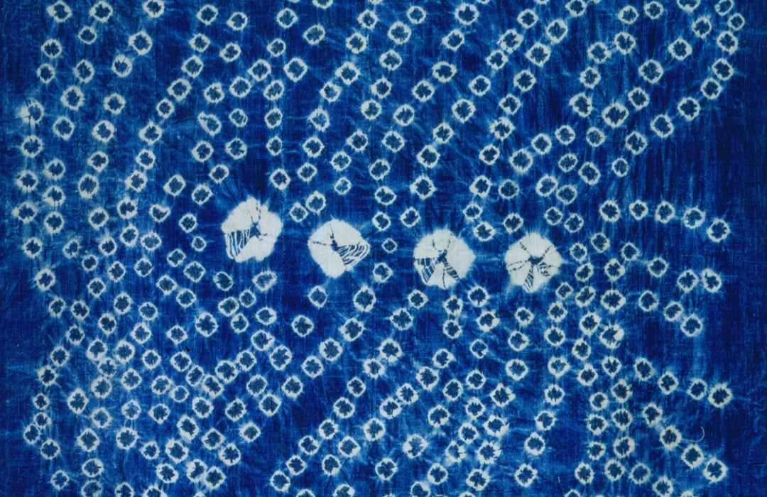 Blue textile with pattern of white circles