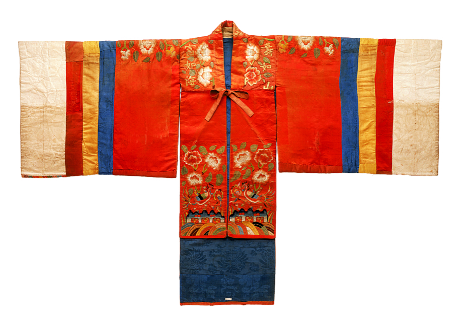 Traditional red robe embellished with floral motifs, and with wide, striped sleeves outstretched