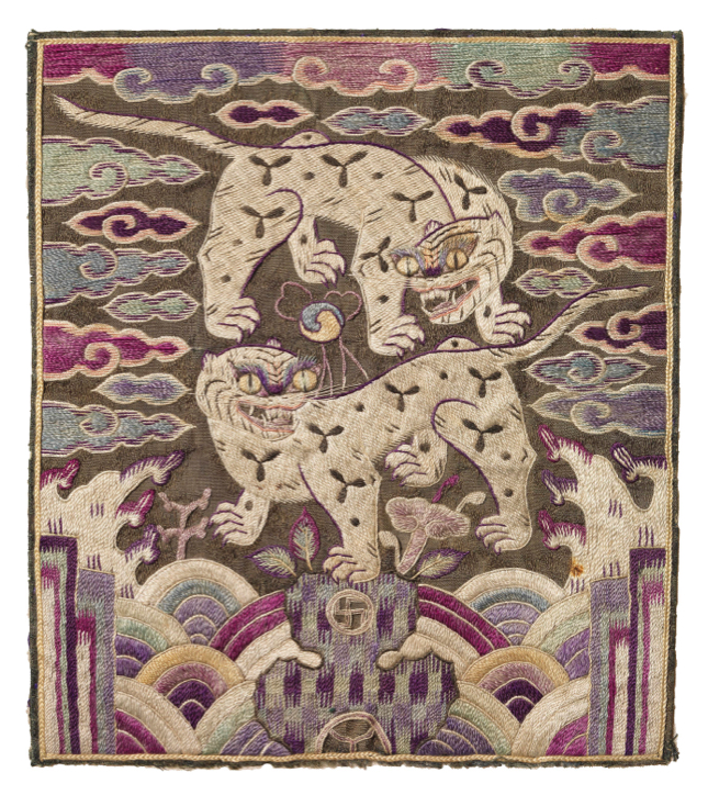Rectangular fabric badge with two white, growling panthers surrounded by swirling purple clouds