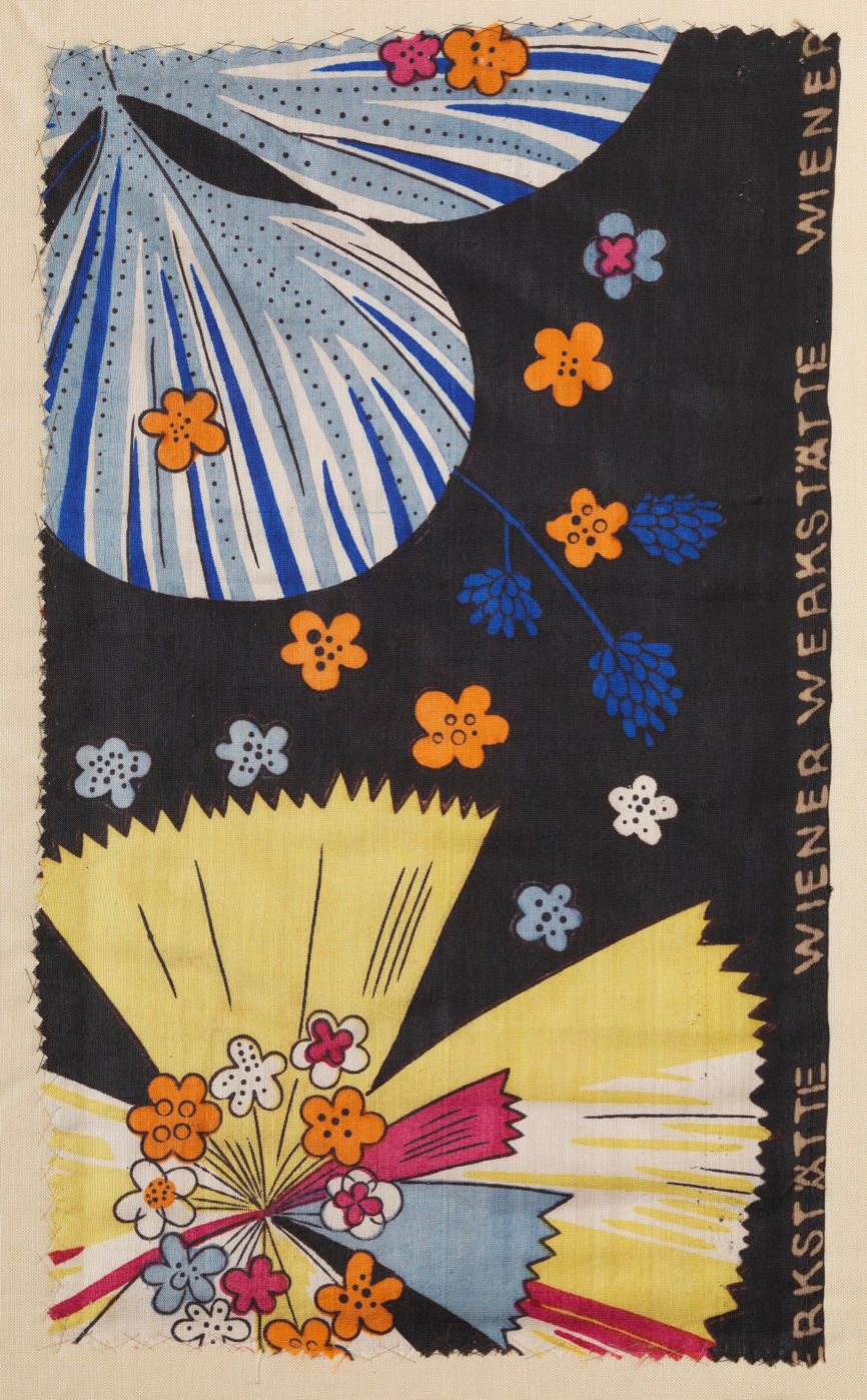 Black textile patterned with various stylized flowers in red, yellow, orange, gray and blue