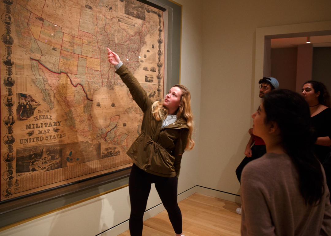 Student pointing at a map