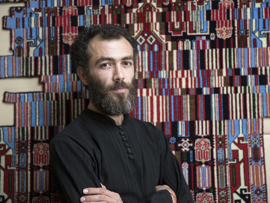 Faig Ahmed with one of his artworks