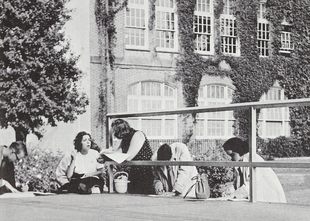 Black-and-white photo of students on quad