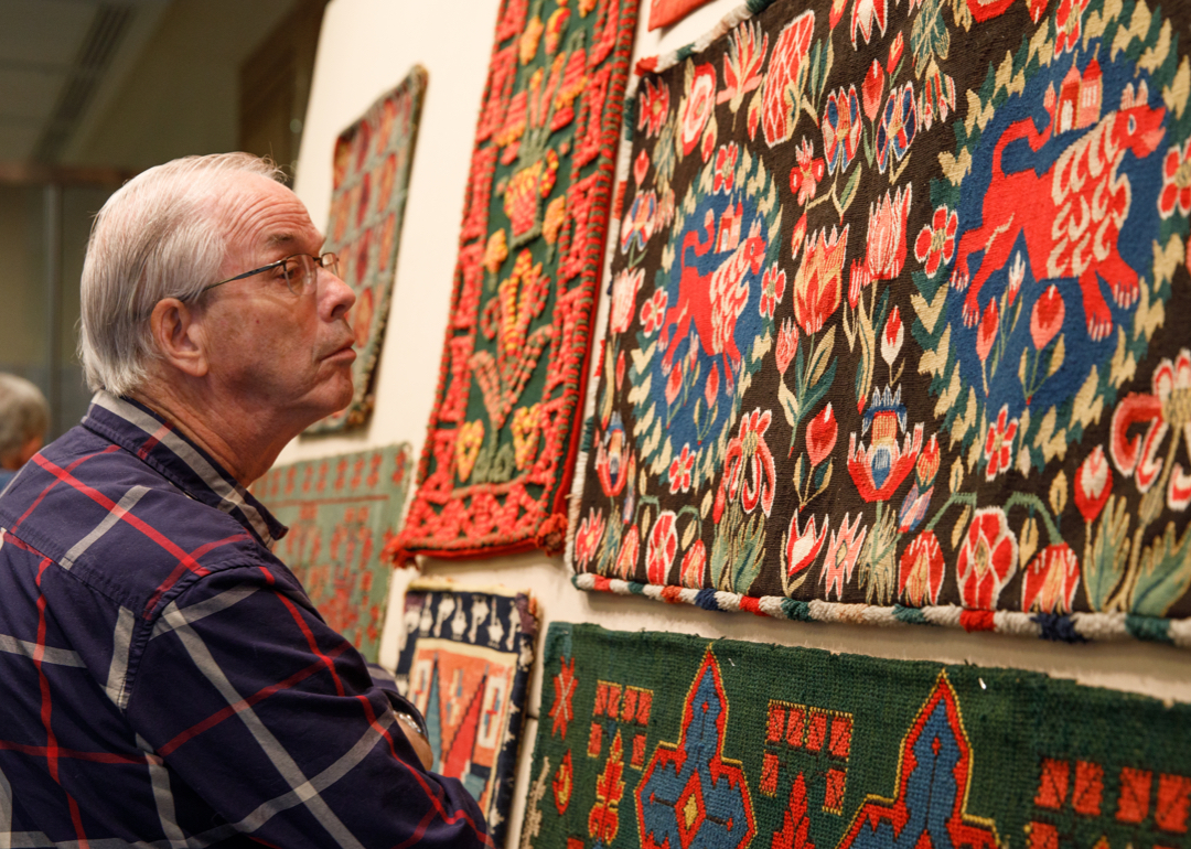 Man looking at textiles