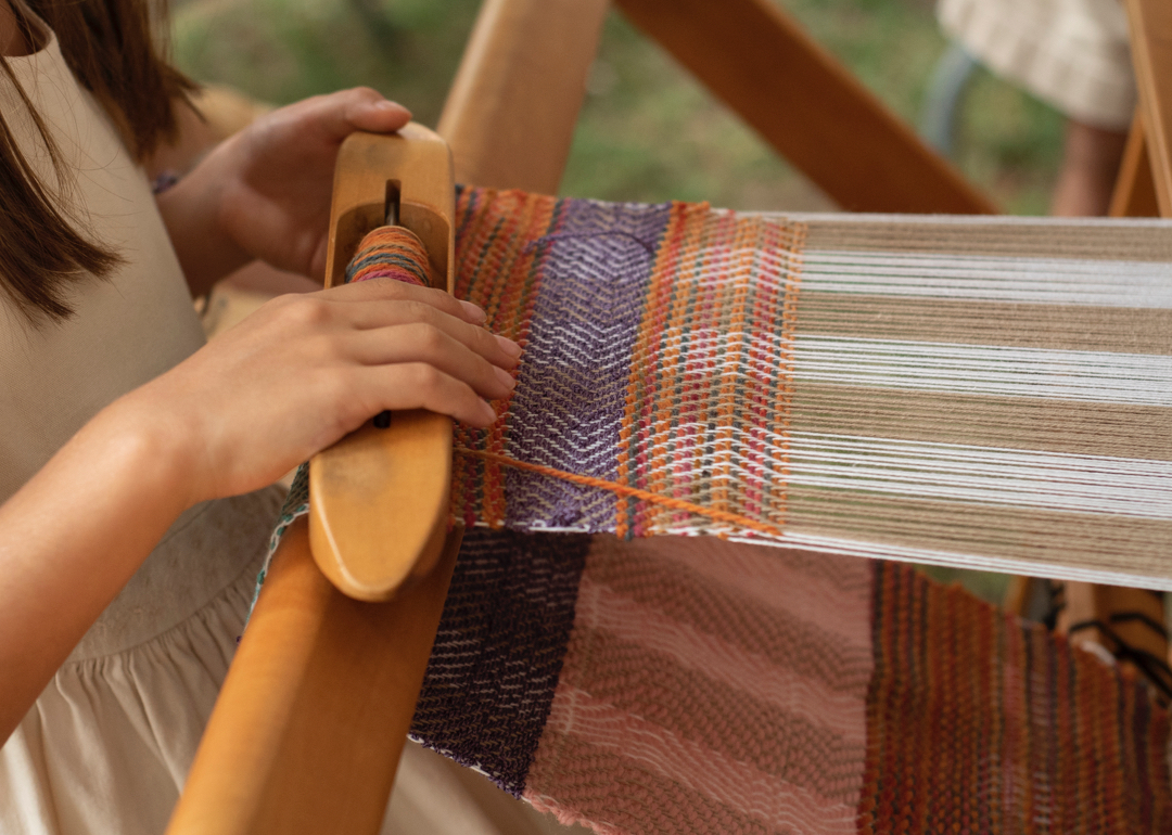 Girl's hands weaving