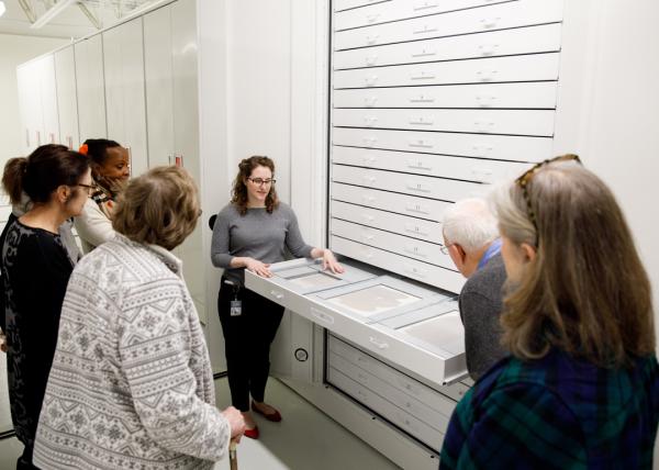 People around storage drawers
