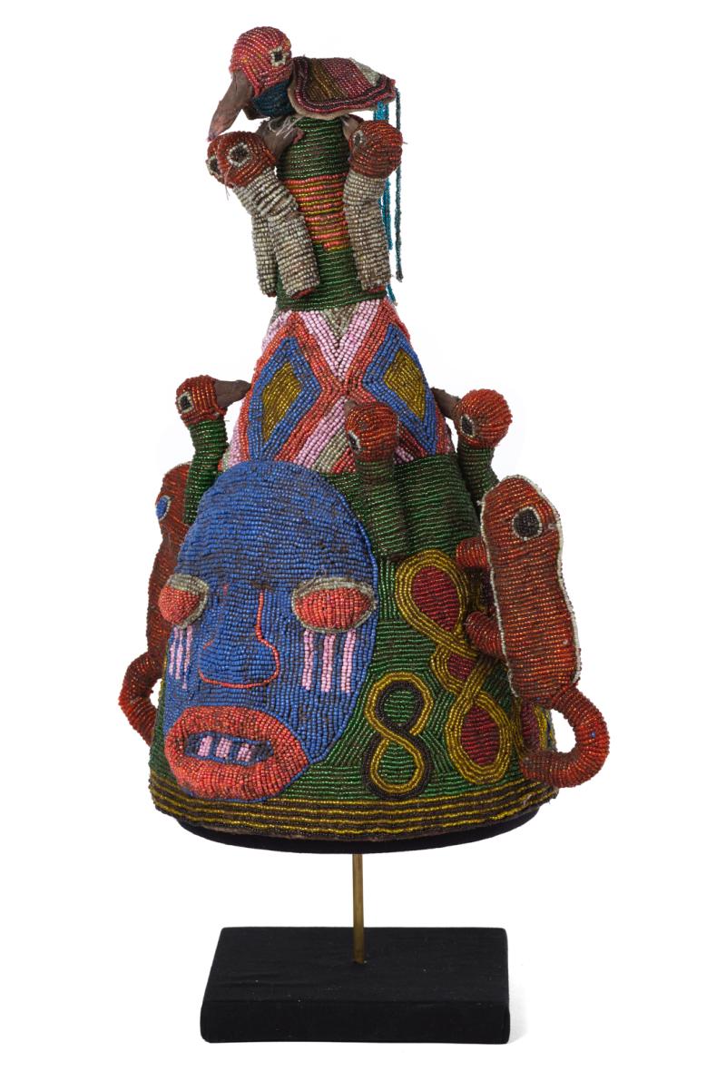 Beaded crown depicting a face