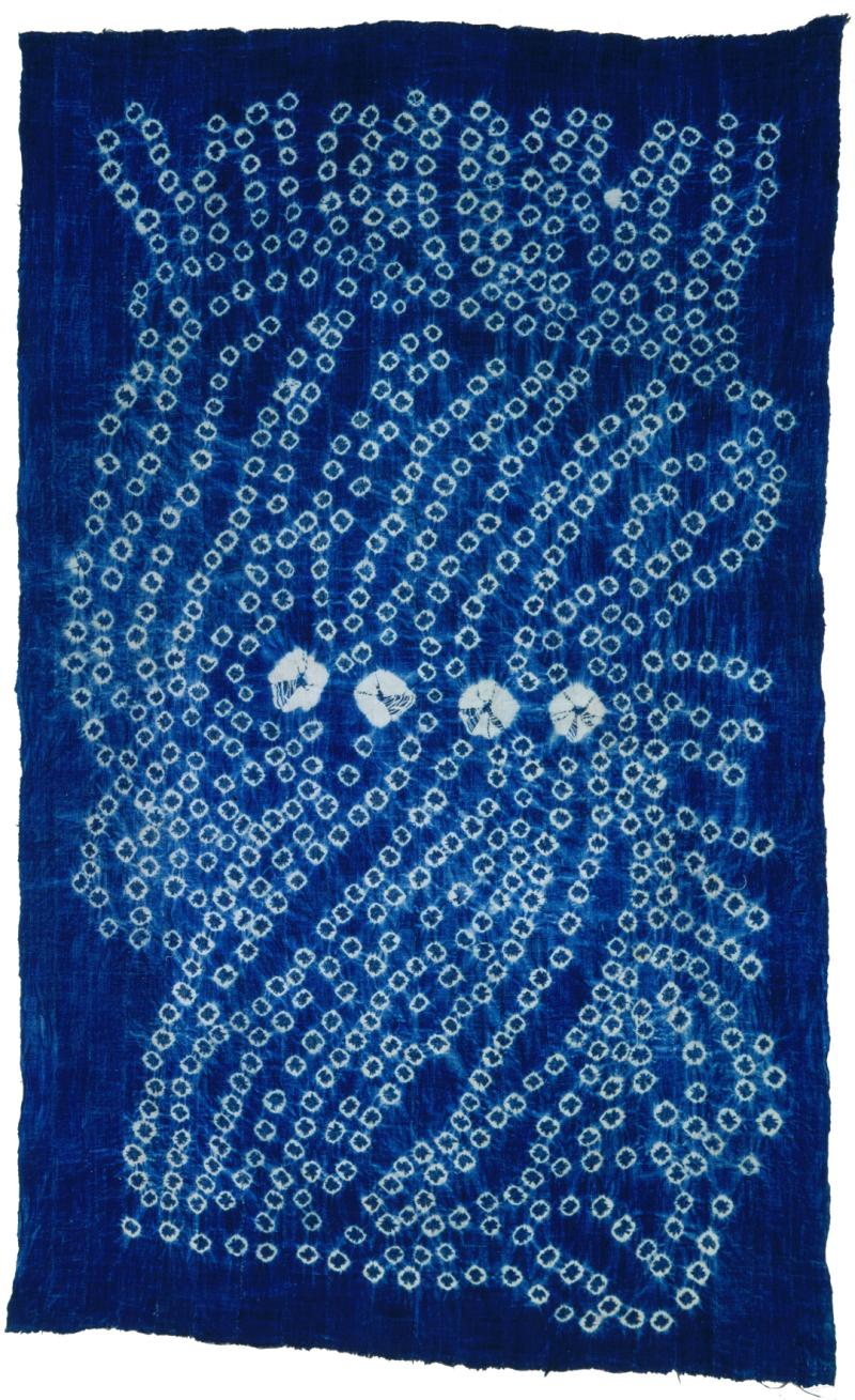 Blue textile patterned with white circles