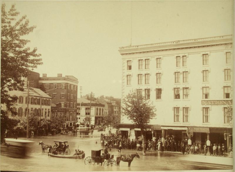 Sepia photograph showing flooded city street