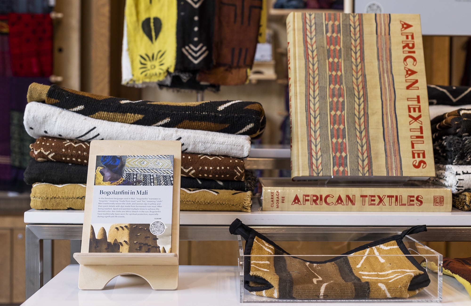 gallery display of books and textiles 