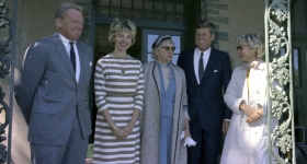 President John F. Kennedy stands in a row with four members of the Pinchot family
