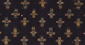 black textile with little winged figures 