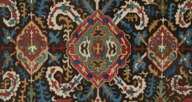 large rug with central blossom design