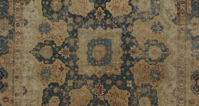 dark brown and blue carpet with central medallion motif 