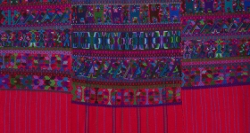 brightly colored blouse in shades of purple, pink, and green