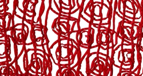 red yarn laid against a white surface
