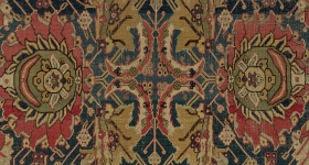 carpet with floral motifs and a center cross design