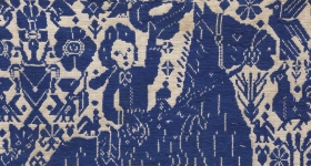 blue embroidery of a horse and its rider